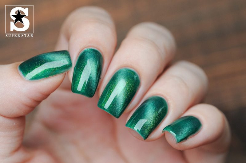 Strange with dark green nails